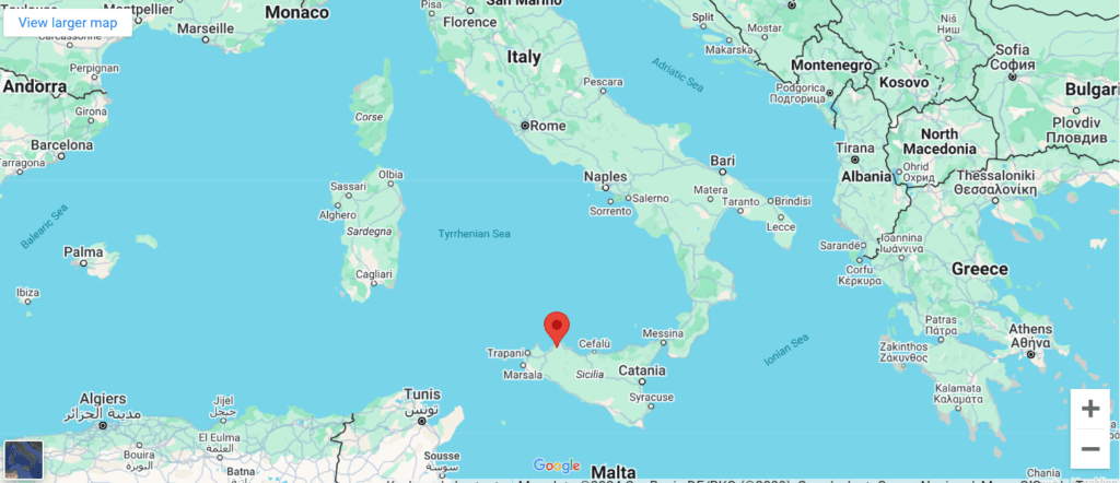 Google Maps view showing Sicily with a red location pin near Carini, Italy