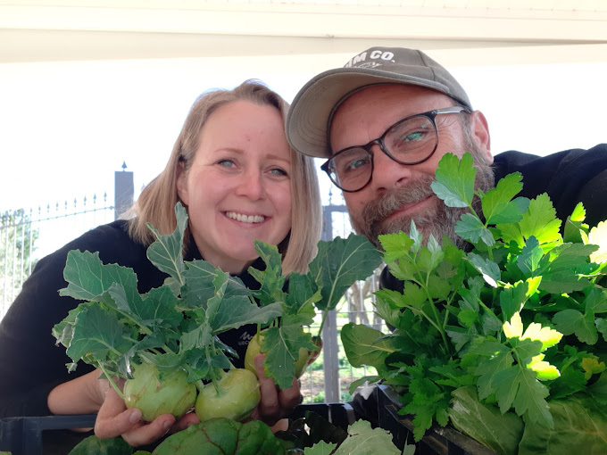 Nino and Brigita with fresh produce at Beddu Cori Farm in Sicily