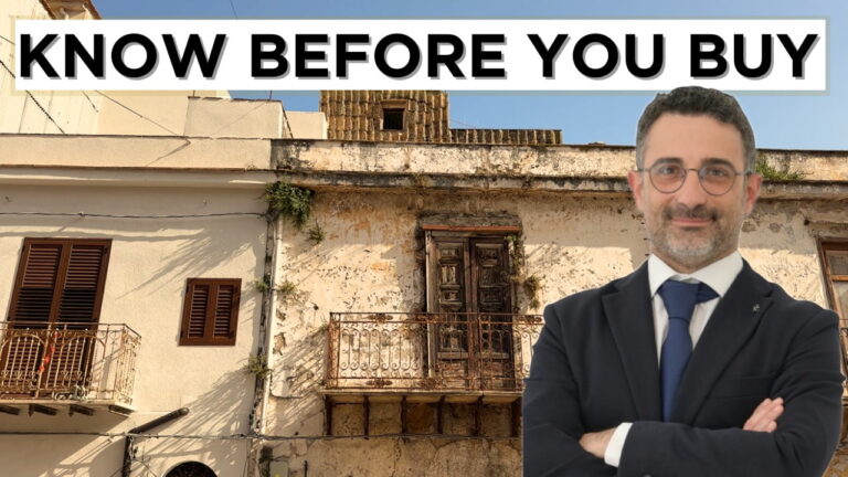 Rosario Amato standing in front of an old Sicilian apartment with a banner reading “Know Before You Buy”