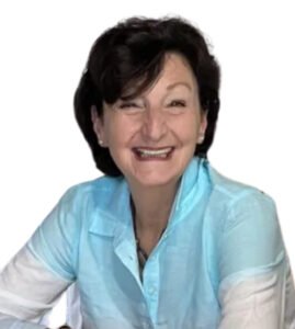 Maria Della Fera smiling, featured in a heartfelt testimonial for Sicilian Life