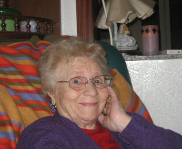 Croce’s mom, a Sicilian nonna, sharing traditional Italian cooking tips with a warm smile